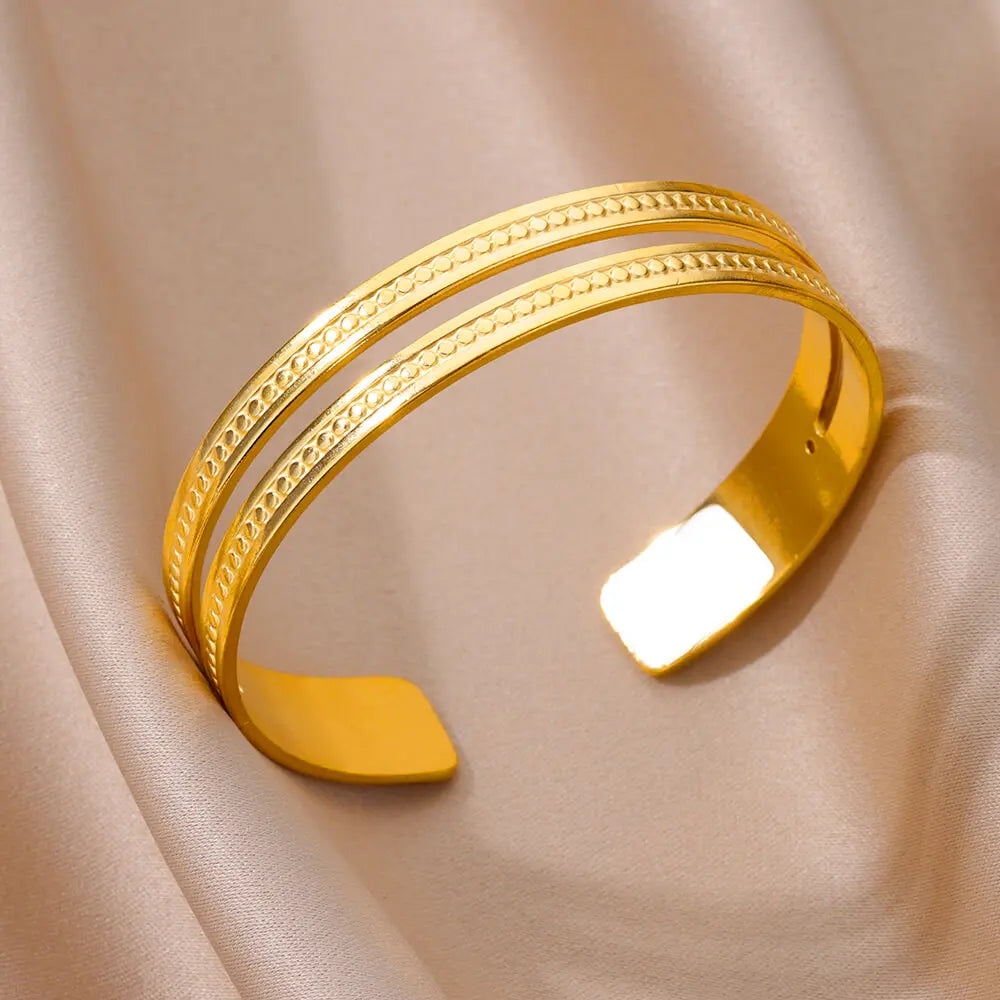 Bracelet jonc doré en acier inoxydable, brillance chic et minimaliste.