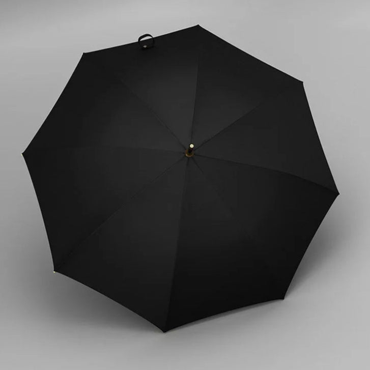 Vue de dos du parapluie noir en bois vintage, tissu de qualité