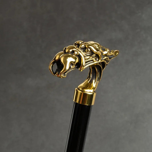 Zoom sur la tête du parapluie sceptre tête de dragon or, détails précis, parfait pour compléter votre style avec luxe et fonctionnalité.