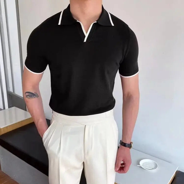 Polo slim fit noir en laine pour homme, tissu doux et léger, alliant confort et élégance à l’anglaise.