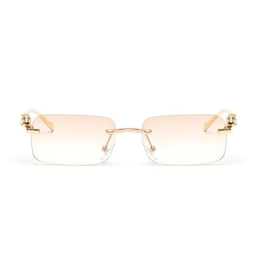 Lunettes de soleil SOLEMAR vue de face, design sophistiqué, monture dorée, verres fumés marrons, protection UV pour un look contemporain