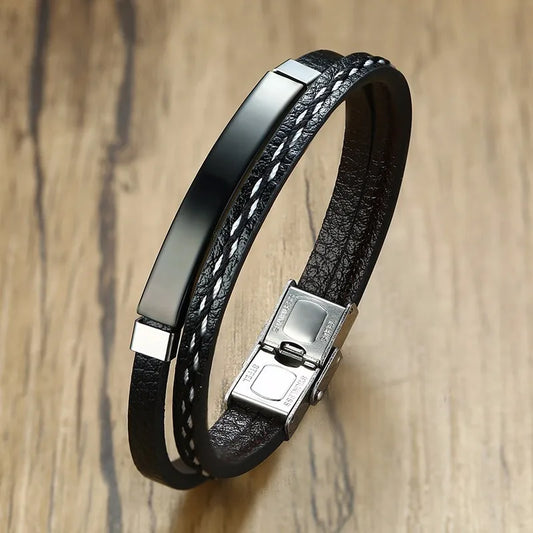 Bracelet en cuir véritable noir avec barre en acier inoxydable, finition sobre et chic