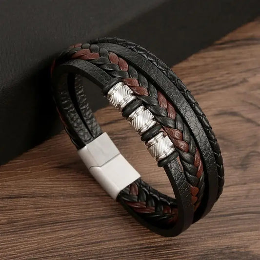 Bracelet en cuir noir et marron tressé, accessoires métalliques, accessoire intemporel et raffiné