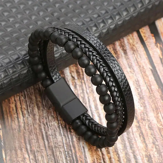 Bracelet en cuir noir tressé, perles noires, accessoire intemporel et raffiné